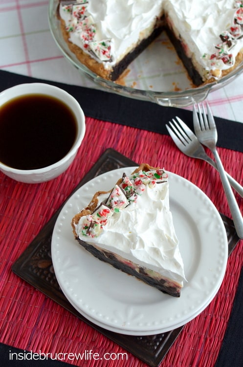 Brownie pie topped with a fun peppermint bark cheesecake is a perfect holiday dessert!