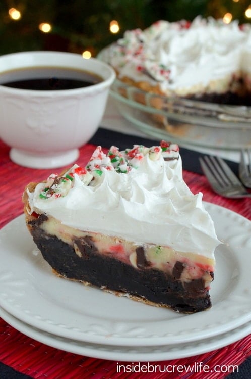 Brownie pie topped with a fun peppermint bark cheesecake is a perfect holiday dessert!