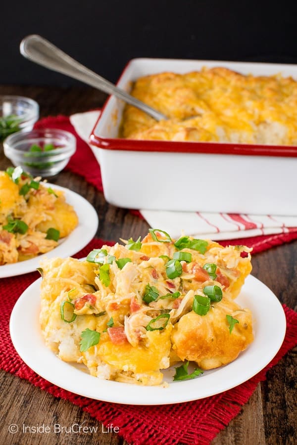 Fiesta Nacho Chicken Bake - cheese, tomatoes, and biscuits make this chicken casserole a hearty comfort food meal. Easy dinner recipe to make on chilly nights!