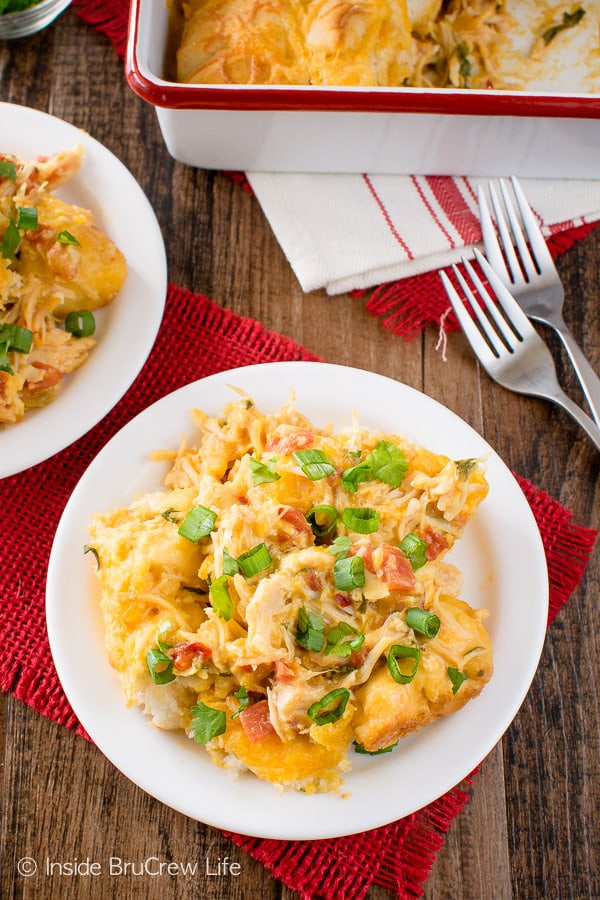 Fiesta Nacho Chicken Bake - this easy chicken casserole is loaded with cheese, biscuits, and tomatoes. Great dinner recipe for those cold winter nights!