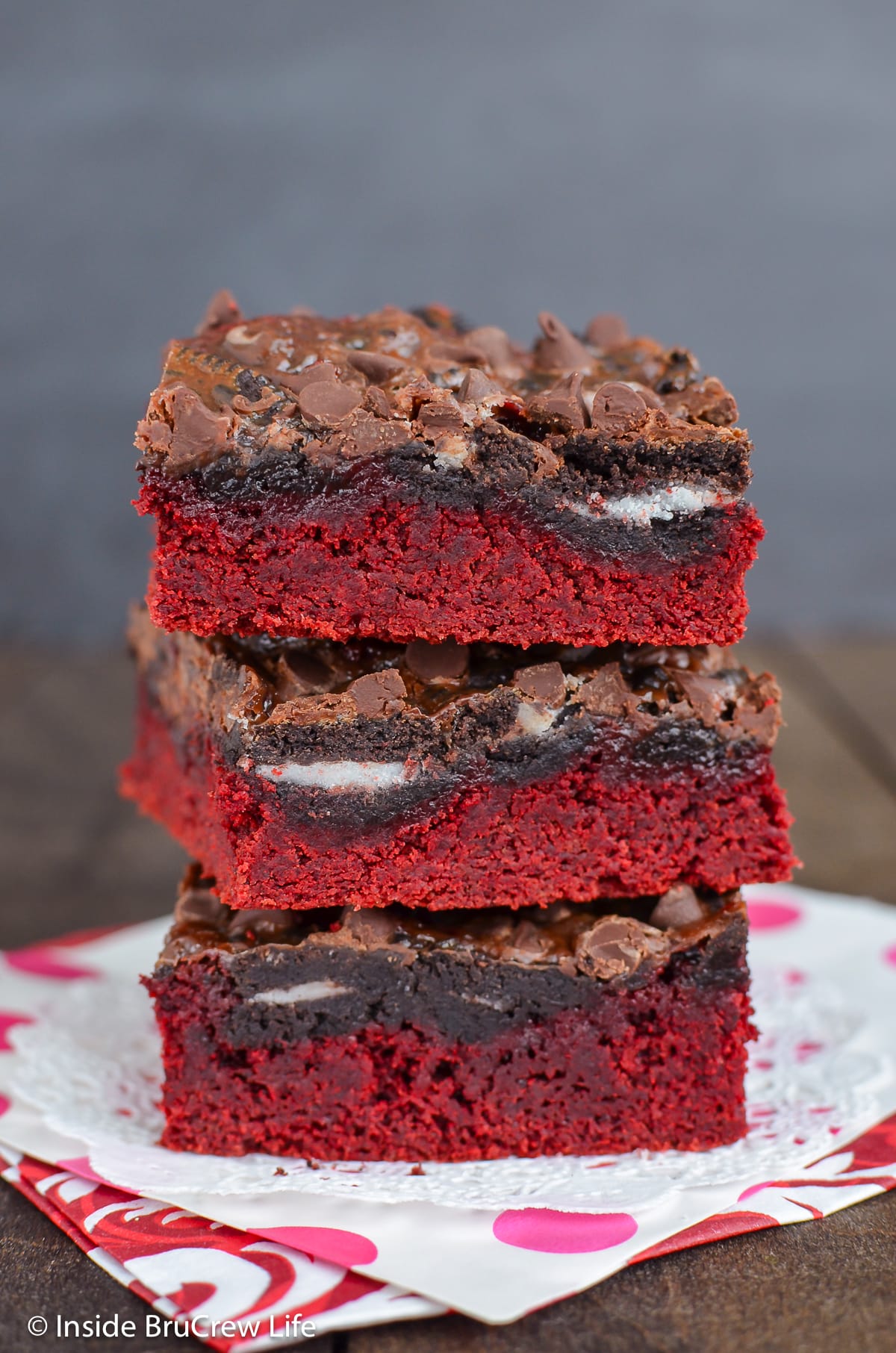A stack of gooey red velvet brownies made with Oreo cookies.