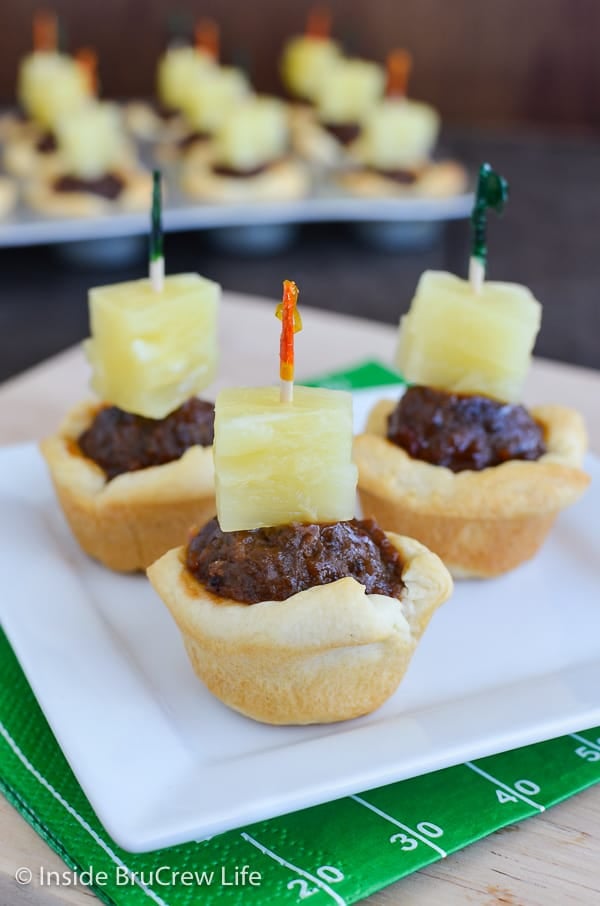 Tropical Meatball Crescent Cups - crescent roll cups filled with barbecue meatballs and pineapple are an easy and delicious snack idea. Make this appetizer recipe for game day parties this fall! 