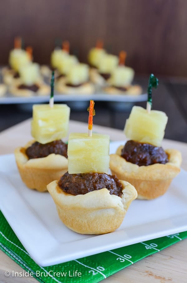 Tropical Meatball Crescent Cups - little crescent roll cups filled with barbecue meatballs and pineapple makes a great appetizer. Make this easy recipe for all your game day parties! 
