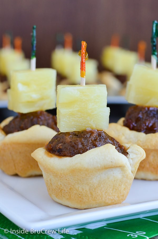 Tropical Meatball Crescent Cups - barbecue meatballs and pineapple in a baked crescent roll cup makes a great appetizer. Make this easy recipe for all your game day parties! 