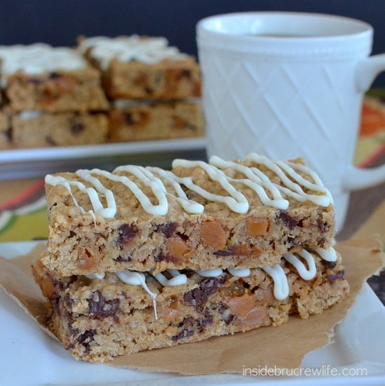 A white plate with two caramel granola bars stacked on it