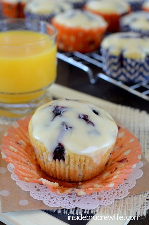 A glazed muffin with blueberries.