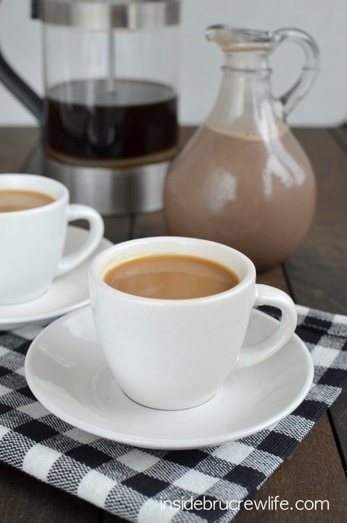 A white coffee cup filled with coffee and flavored with salted caramel mocha creamer