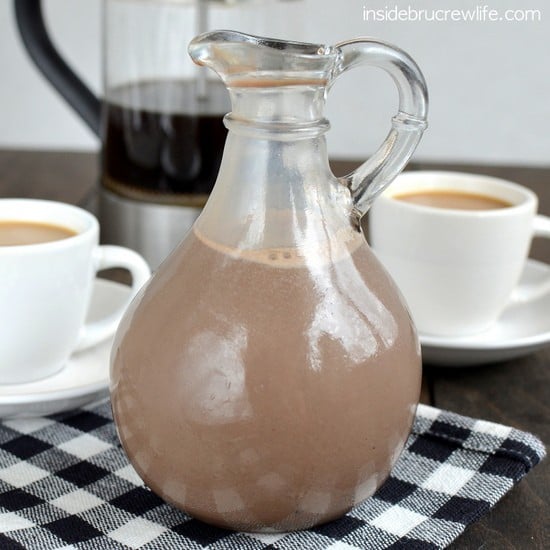 A black and white towel with a bottle filled with homemade salted caramel mocha creamer