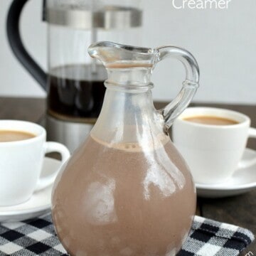 A clear bottle filled with homemade salted caramel mocha creamer