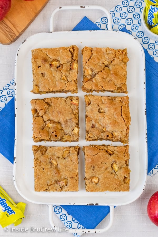 Overhead picture of a white tray with six apple blondies on it.