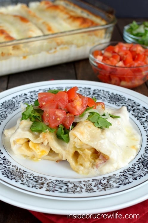 Chicken Bacon Alfredo Enchiladas - chicken and bacon filling inside a tortilla with creamy Alfredo sauce and cheese makes everyone smile at the dinner table.