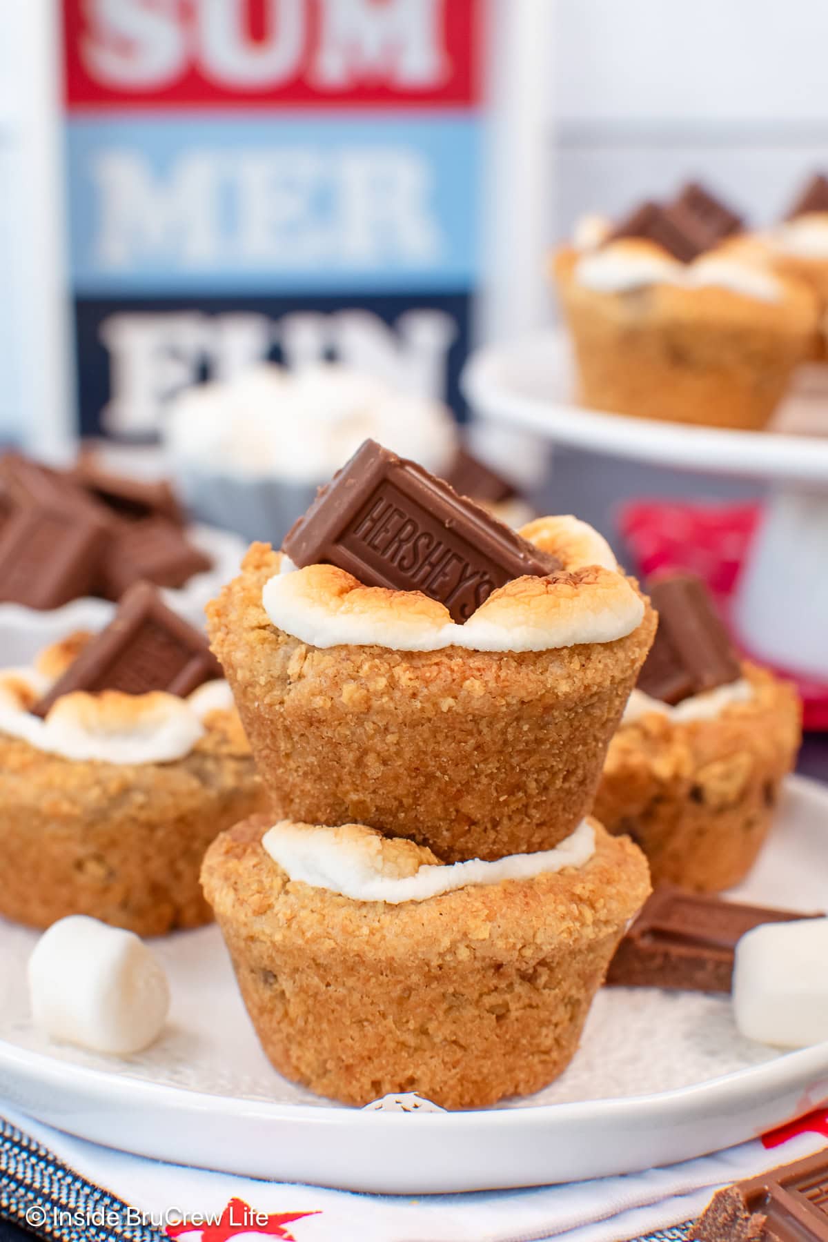S'mores cookie cups stacked on a white plate.