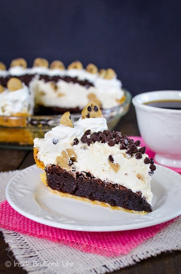 Cookie Dough Cheesecake Brownie Pie - three layers of goodness make this brownie pie an absolutely stunning dessert. This is a must make recipe for every party! #browniepie #cookiedoughbites #nobakecheesecake #bestdessert #cheesecakelove