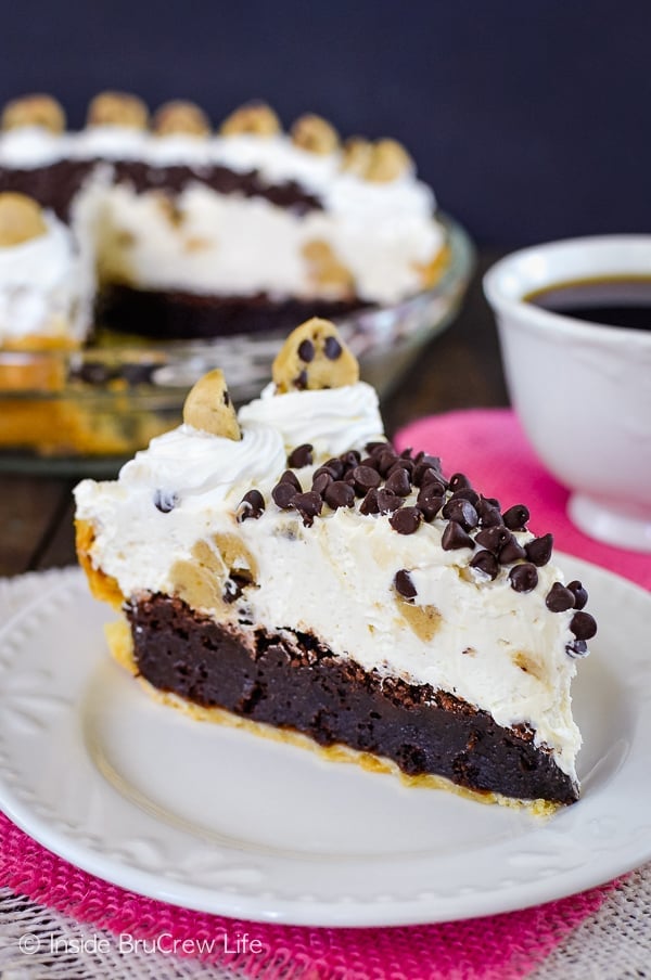 Cookie Dough Cheesecake Brownie Pie - layers of brownies, no bake cheesecake, and cookie dough bites creates a dessert that is ridiculously delicious!! You have to make this recipe for parties! #browniepie #cookiedoughbites #nobakecheesecake #bestdessert #cheesecakelove