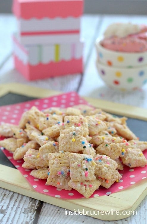 Crushed animal cookies and chocolate coat this easy muddy buddies snack mix.  It will disappear in a hurry!