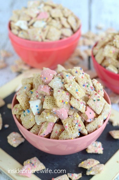 Crushed animal cookies and chocolate coat this easy muddy buddies snack mix.  It will disappear in a hurry!