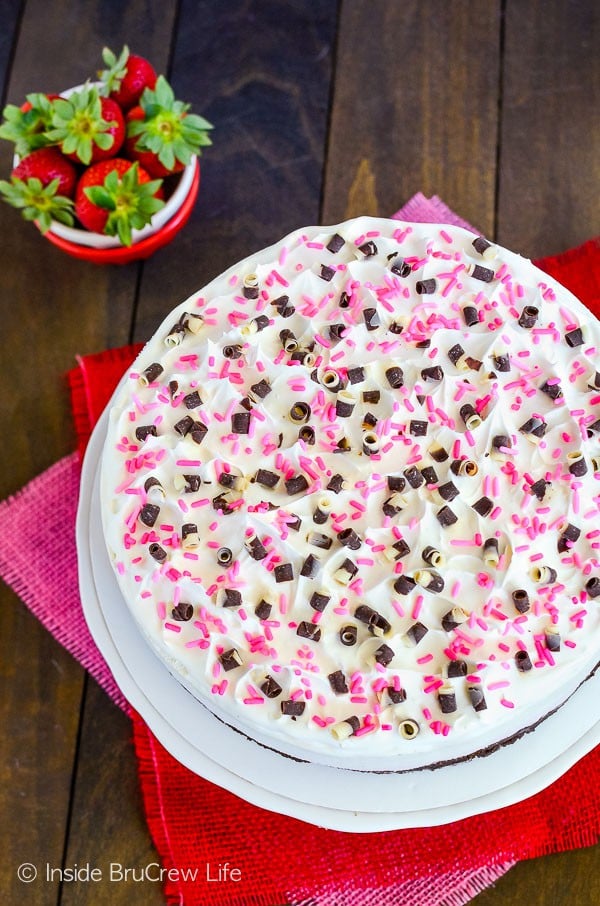 Neapolitan Brownie Ice Cream Cake - strawberry and vanilla ice cream on top of a homemade brownie crust makes a great ice cream cake! Try this easy recipe for parties! #icecreamcake #brownies #cake #easyrecipe