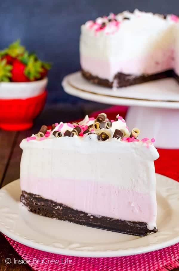Neapolitan Brownie Ice Cream Cake - layers of homemade brownies with strawberry and vanilla ice cream makes a fun cake! Make this easy recipe for all kinds of parties. #icecreamcake #brownies #cake #easyrecipe