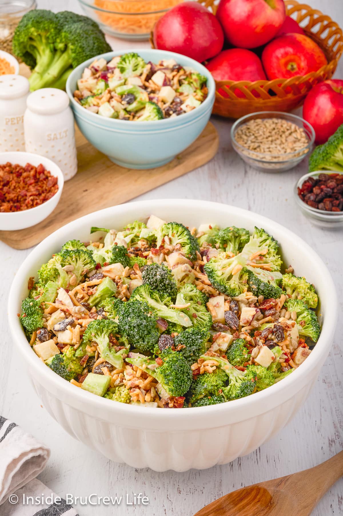 A crunchy green salad in a white bowl.