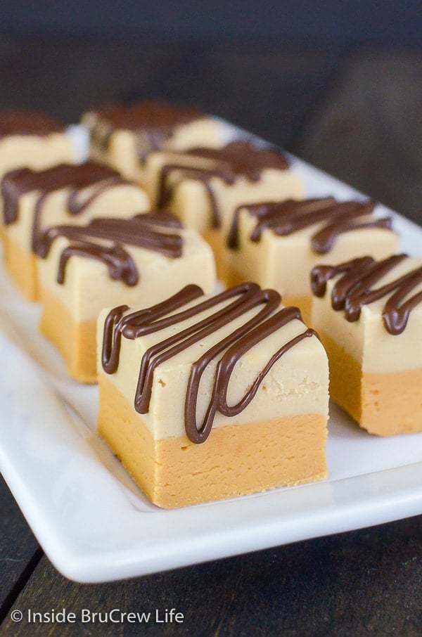 Squares of coffee fudge on a white tray.