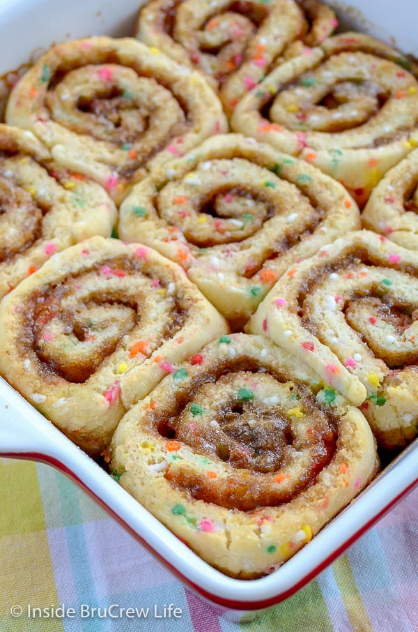 Overhead picture of a pan filled with baked funfetti cinnamon rolls