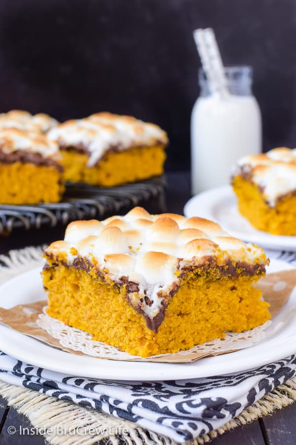 Best Pumpkin S'mores Bars - soft pumpkin cake bars topped with gooey marshmallows and chocolate makes a great fall dessert! #pumpkin #pumpkinbars #smores #chocolate #marshmallow