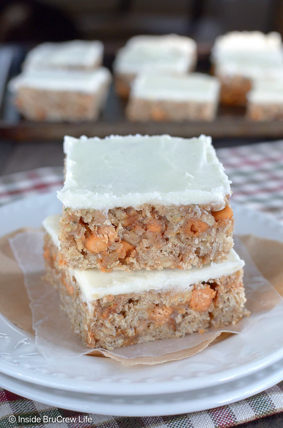 Two oat bars with butterscotch chips and frosting.