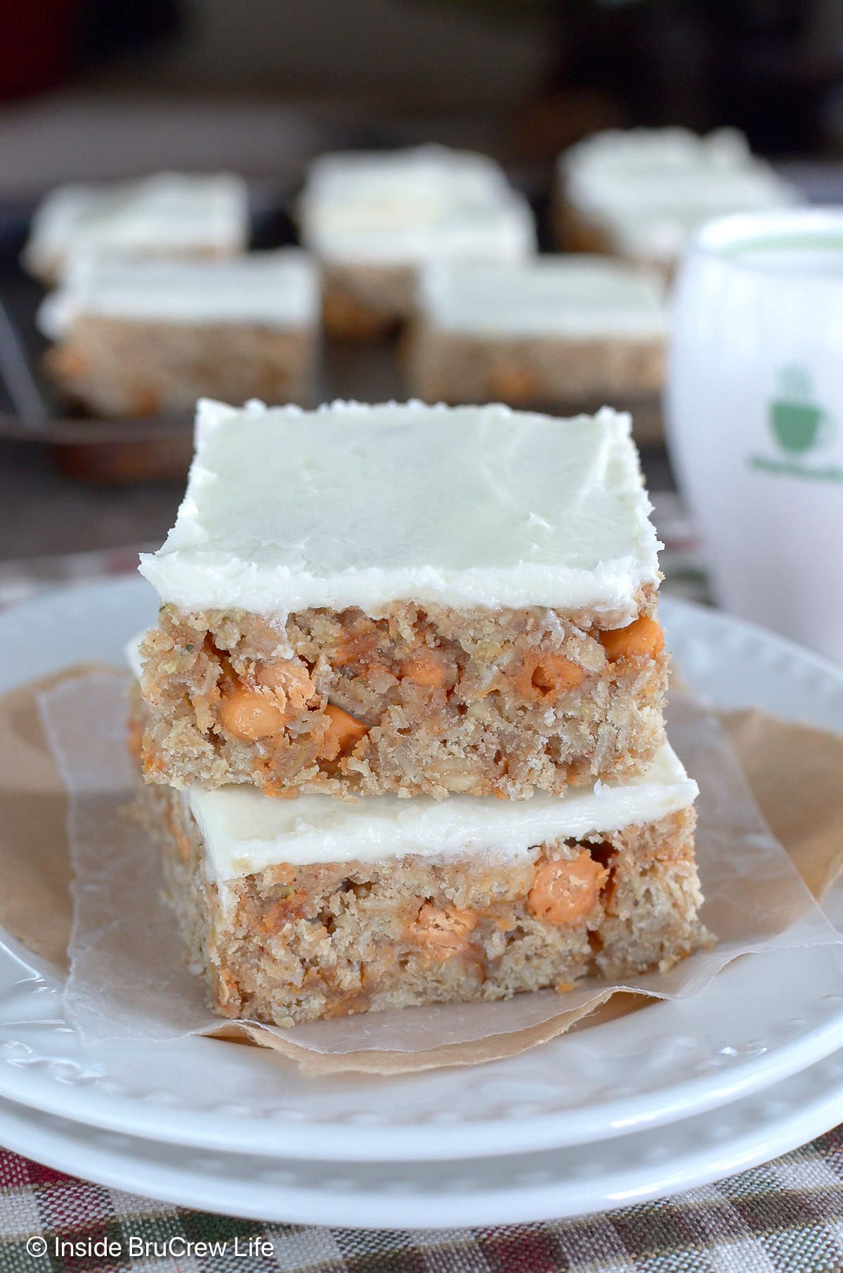 A white plate with butterscotch oat bars on it.