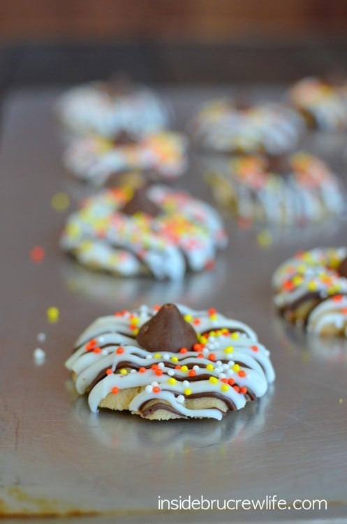 These easy coffee spritz cookies are covered in chocolate drizzles and sprinkles. Perfect fall treat!!!