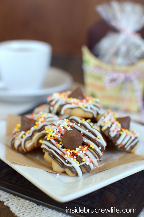 These easy coffee spritz cookies are covered in chocolate drizzles and sprinkles. Perfect fall treat!!!