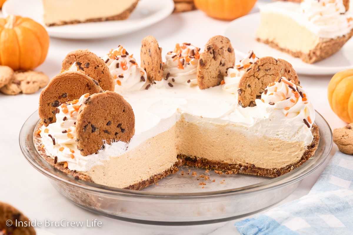 A pie plate filled with a no bake pumpkin cheesecake.