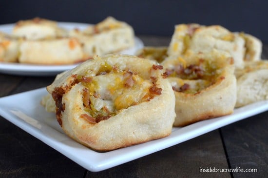 Pizza dough with cheese and bacon rolled up in it.