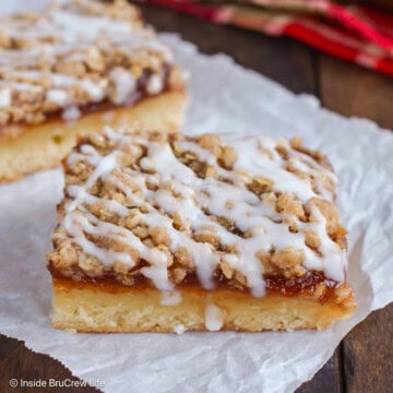 A crumble coffee cake square on parchment paper.