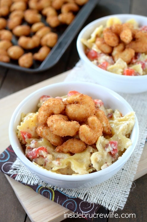 Easy homemade Alfredo sauce that can be made in minutes. Bacon, red peppers, and popcorn shrimp make this pasta taste amazing!