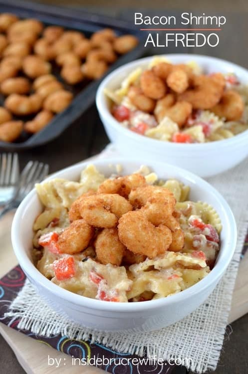 Easy homemade Alfredo sauce that can be made in minutes. Bacon, red peppers, and popcorn shrimp make this pasta taste amazing!