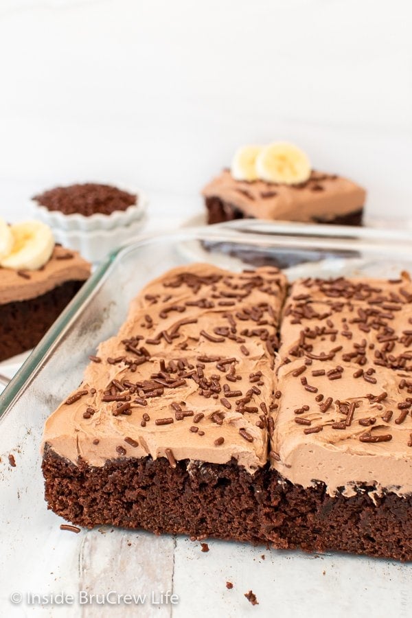 A glass dish with chocolate banana cake in it.