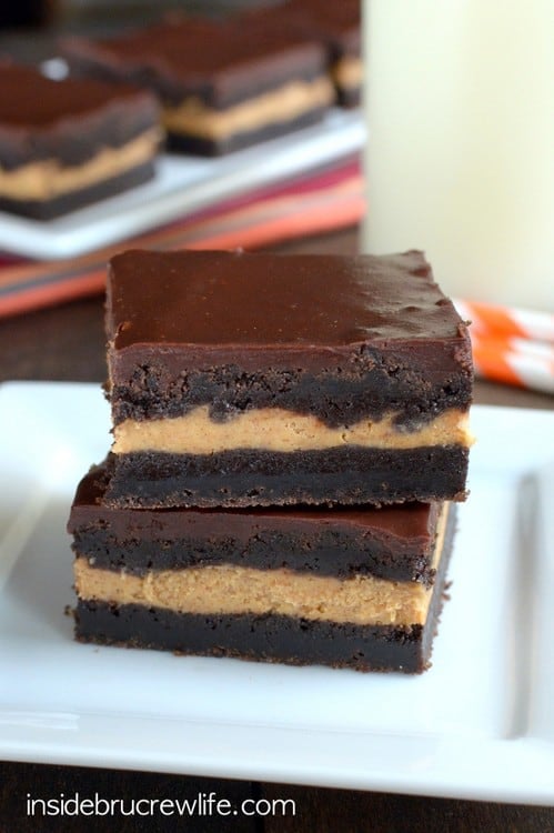 Chocolate cookie bars with a pumpkin cheesecake filling in the middle makes these a decadent fall dessert.