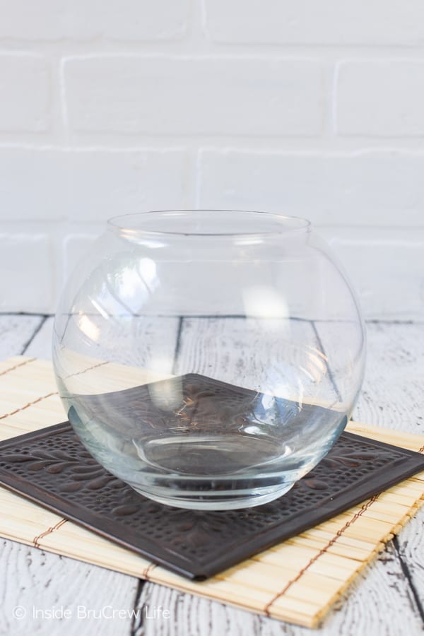 A white background with a clear round jar.