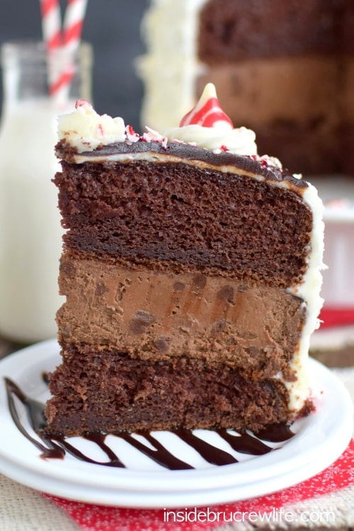 Candy Cane Chocolate Cheesecake Cake - layers of chocolate cheesecake and cake with peppermint frosting is one holiday dessert you have to make this year!  Great recipe for holiday parties!