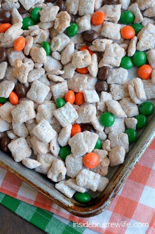 Cinnamon Pumpkin Spice Muddy Buddies - pumpkin spice chocolate and fall colored candies make this snack mix so easy. Great no bake recipe for fall munching!