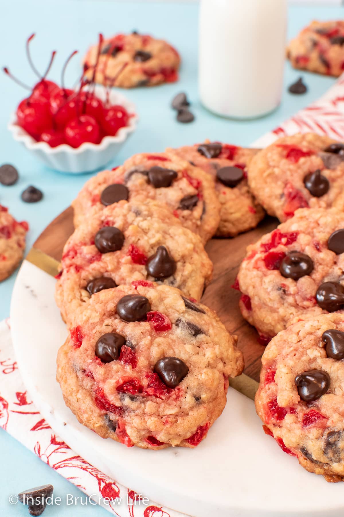 A tray of cherry cookies topped with chocolate chips.