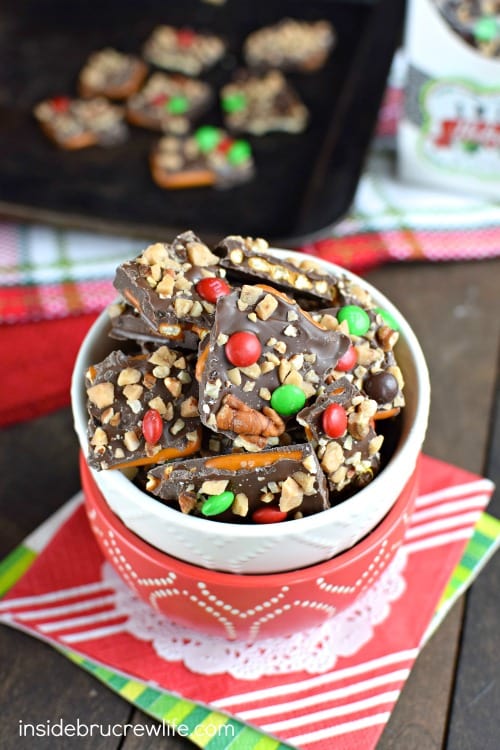 Chocolate covered pretzel bark topped with pecans, toffee, and M&M's is such a fun sweet and salty treat!