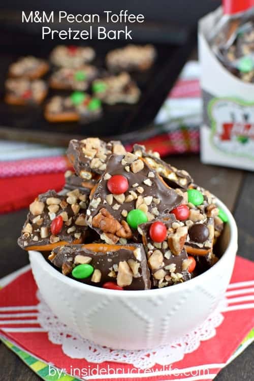 Chocolate covered pretzel bark topped with pecans, toffee, and M&M's is such a fun sweet and salty treat!