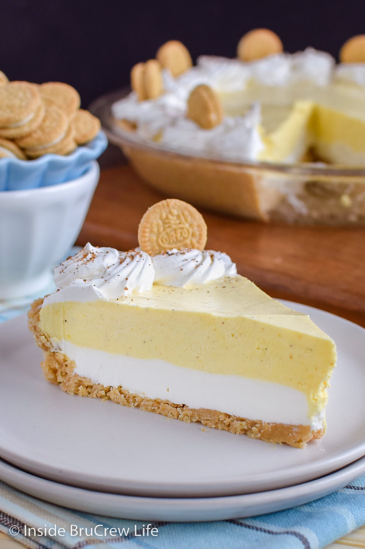 A slice of no bake eggnog pie on a white plate.