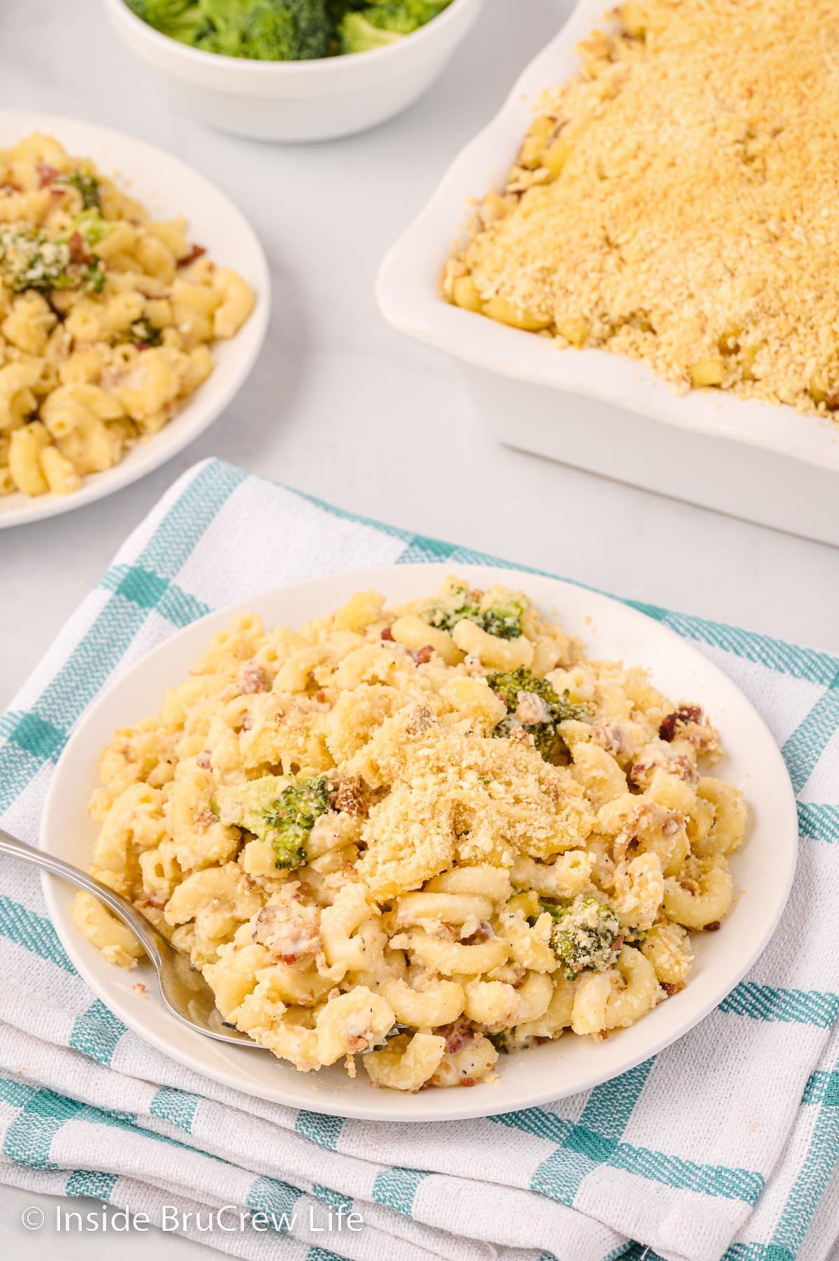 A white plate filled with macaroni and cheese.