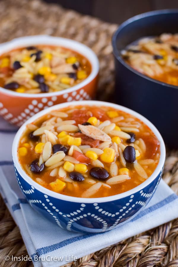 Easy Chicken Enchilada Soup - this easy soup can be on your dinner table in under 20 minutes. It is a great comfort food meal the whole family will love. #dinner #soup #chickenenchilada #chicken #comfortfood