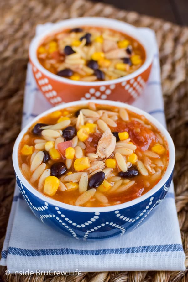 Easy Chicken Enchilada Soup - a pot of this easy soup is loaded with chicken, veggies, and pasta. Make this recipe for dinner and enjoy comfort food in minutes. #dinner #soup #chickenenchilada #chicken #comfortfood