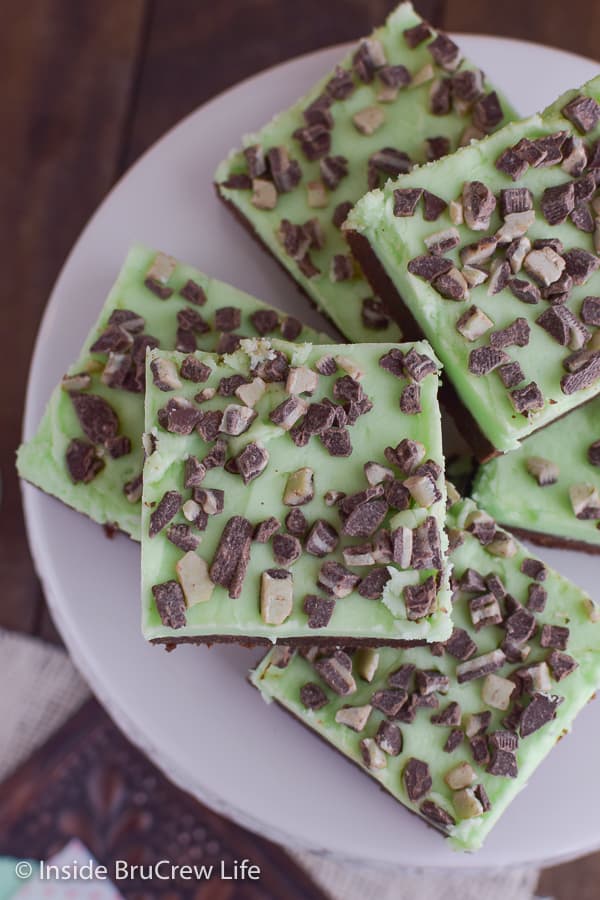 Overhead picture of the top of a white plate with chocolate mint sugar cookie bars stacked on it