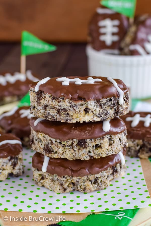 Three football rice krispie treats stacked on top of each other.