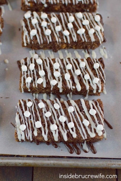 Overhead picture of salted caramel hot chocolate granola bars drizzled with chocolate and mini marshmallow bits